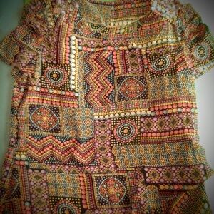 Brand new woman’s shirt with necklace.